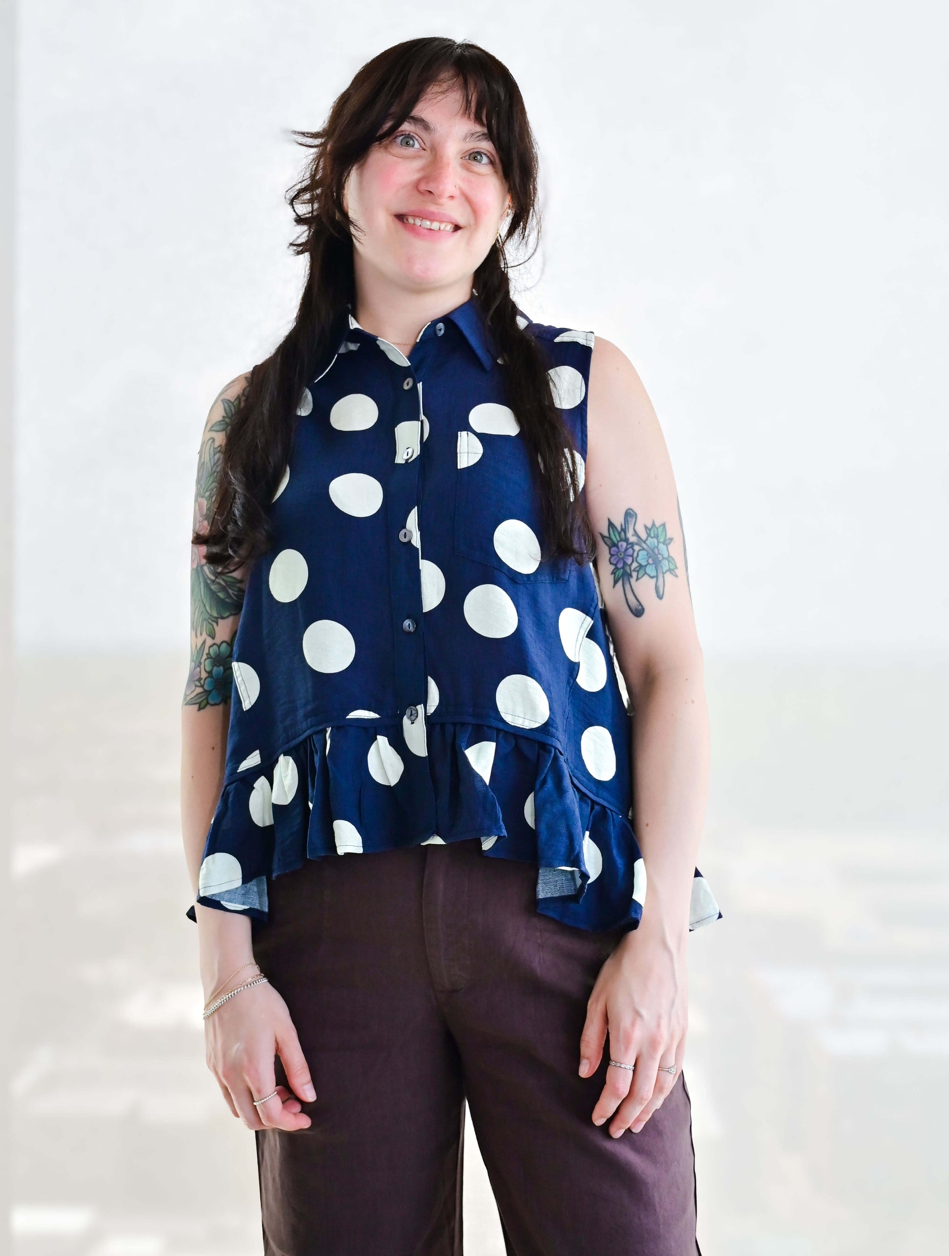 Polka Dot Sleeveless Button Up Blouse With Ruffle Hem